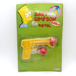 Simpsons Bart Pistol Con 2 Trompos Amarilla 1992 Ukitoys